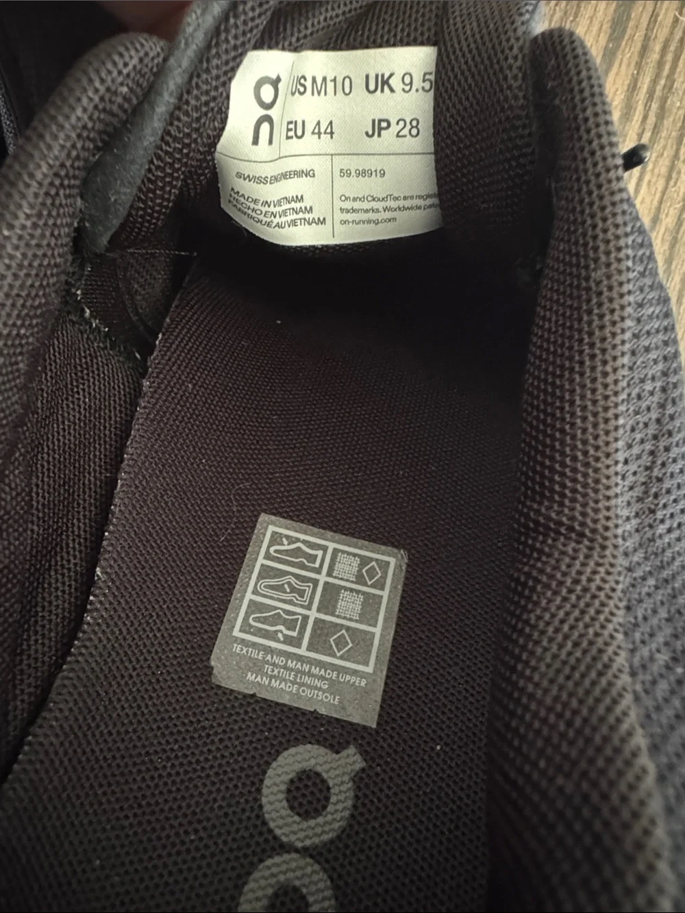 On Running Men's Athletic Sneakers in Black and White size 10